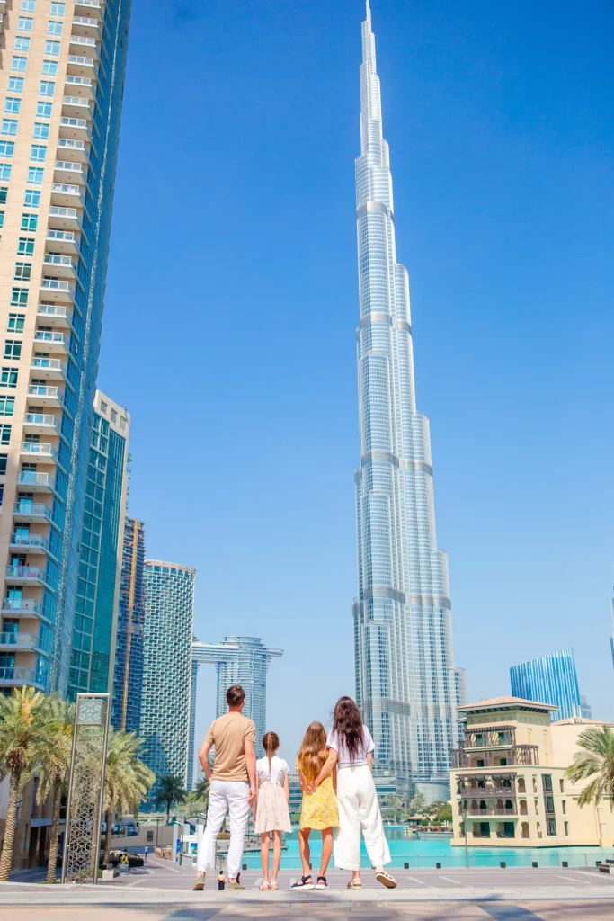 happy family walking in dubai with skyscrapers in 2025 02 12 03 05 04 utc