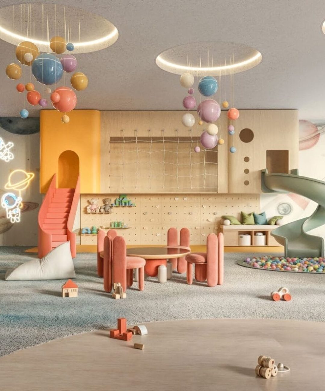 Colorful children's playroom at Muheira Maysan with a slide, ball pit, and modern furniture.